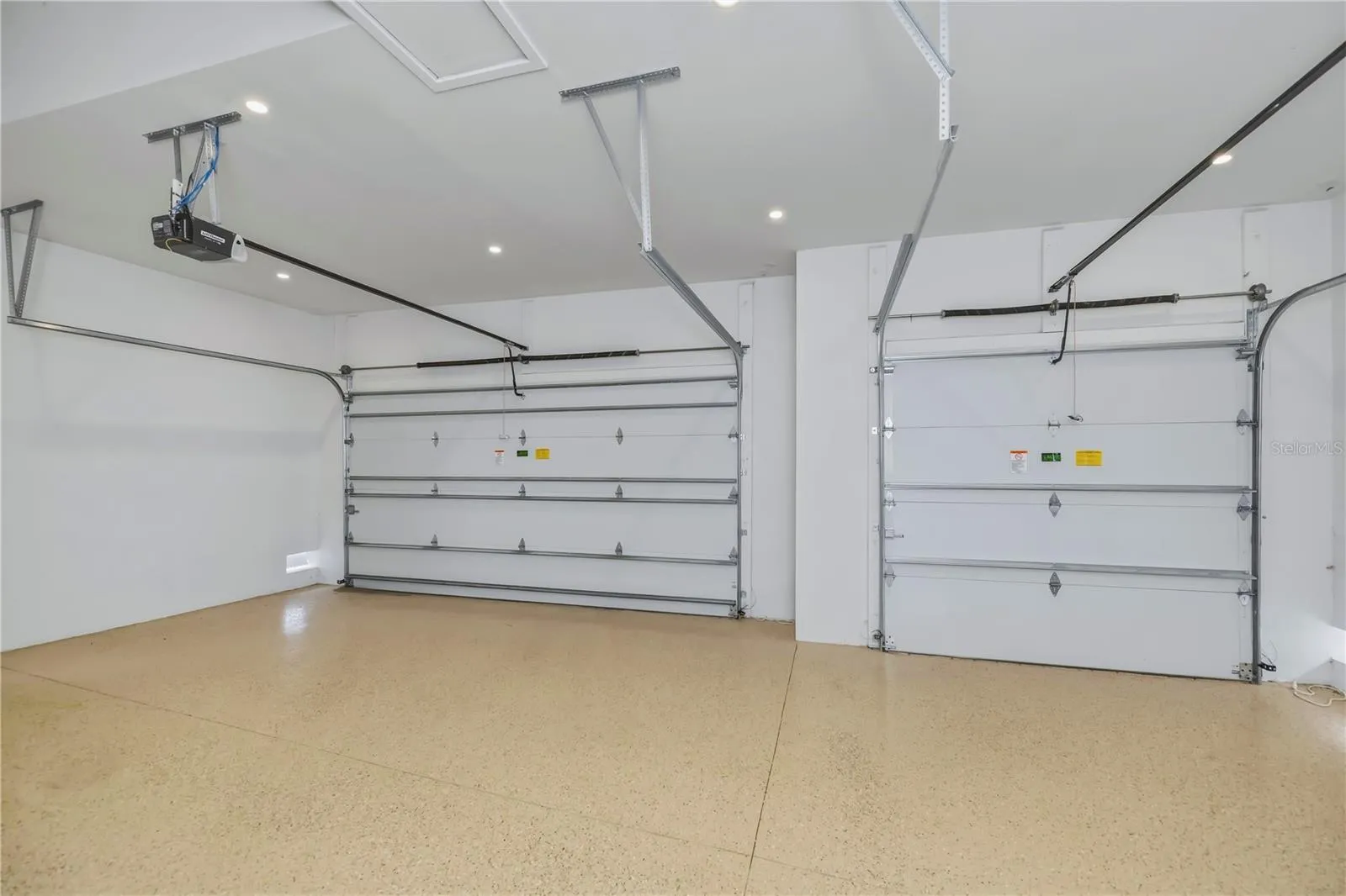 3 Car garage with epoxy floor and 2 Bay Door