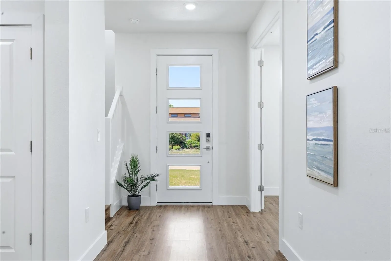 Foyer - den or extra bedroom with French doors to the right