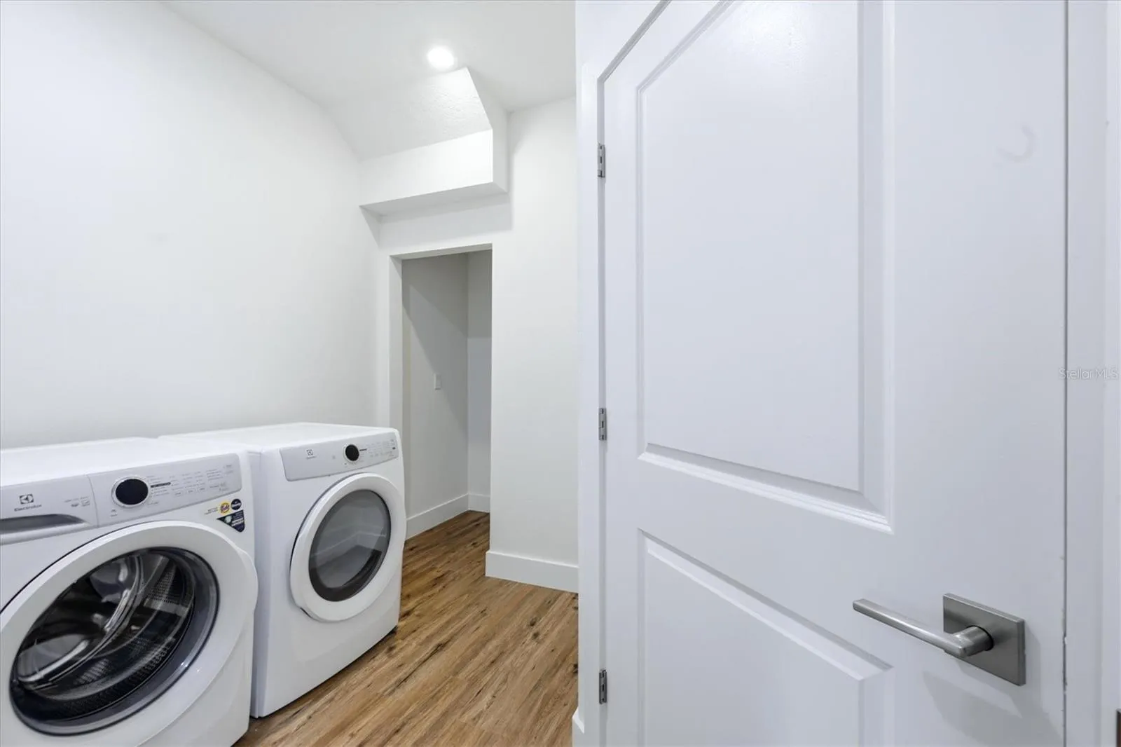 Generously sized laundry room with extra storage