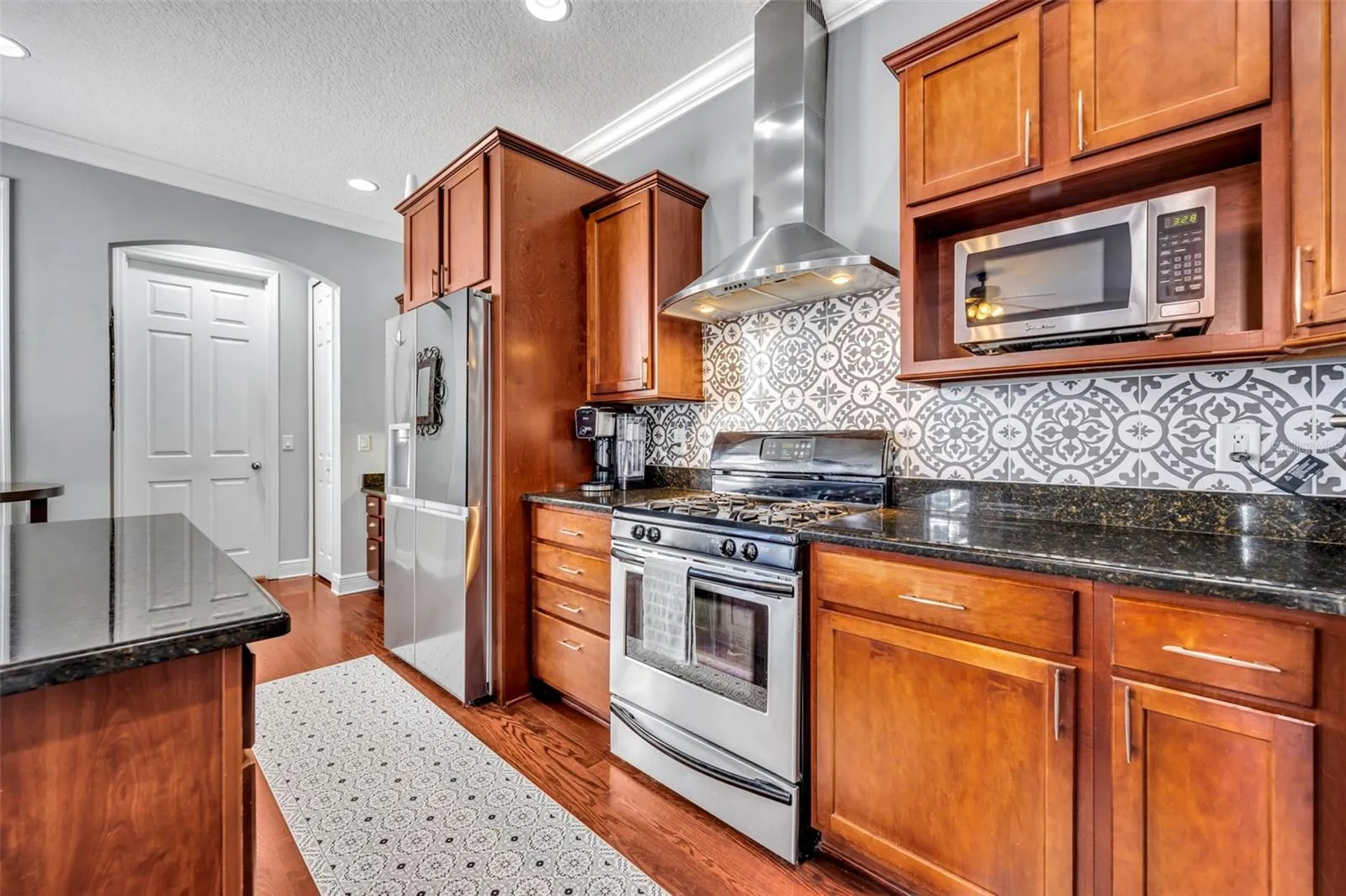 Kitchen view with door leading to laundry room
