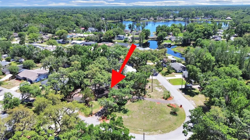 Located in Tracers Lake Keen Estates on a large corner lot that spans the entire bend of the road, moments from ski-friendly Lake Keen (in the background).