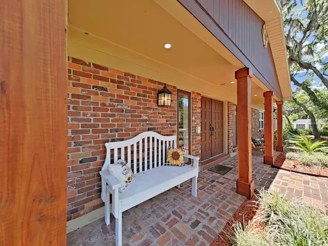 The brick covered walk and warm lantern lighting provide the sweetest welcome home!