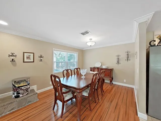 Large dining room with window view & plenty of space to host holiday dinners & special gatherings.