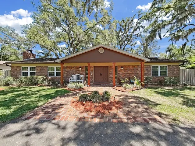 Welcome to 18835 Tracer Drive, a classic brick ranch home, nestled under a canopy of majestic mature trees, with charming curb appeal & a welcoming covered front porch.