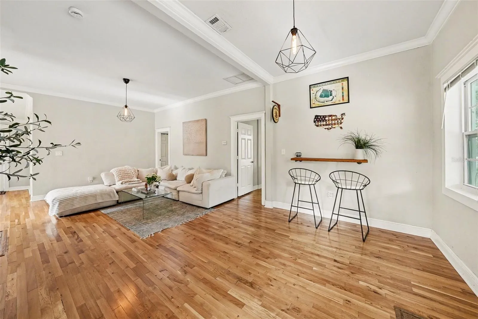 Living space with decorative fireplace and flexible seating arrangement.