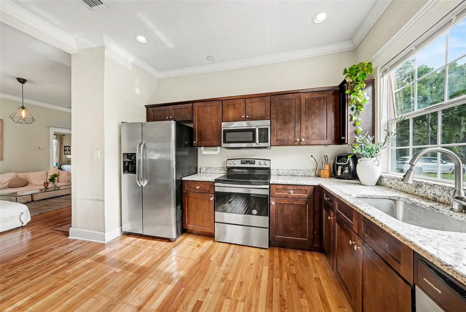 Kitchen opening to living space, ideal for everyday living and entertaining.