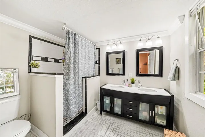 Primary bathroom with clean finishes and functional layout.