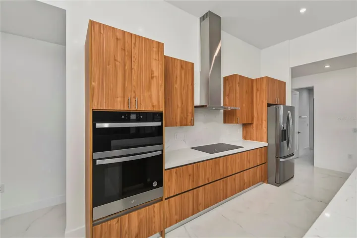 Quartz Backsplash and Premium Whirlpool Appliances.