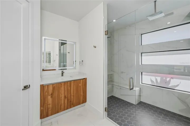 Double Vanities with Luxurious Walk-In Shower.