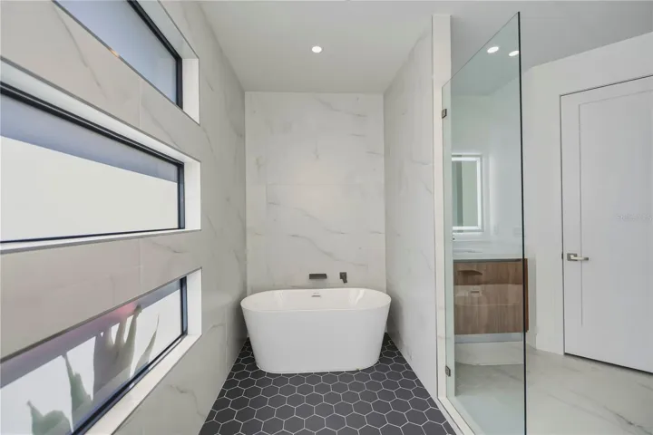 Walk-In Shower, Free Standing Tub with Glass Enclosure.
