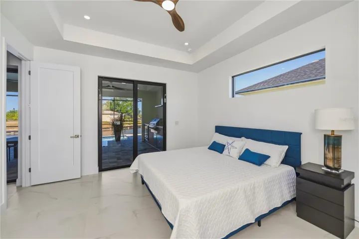 Primary Bedroom with Tray Ceiling and Water Views.