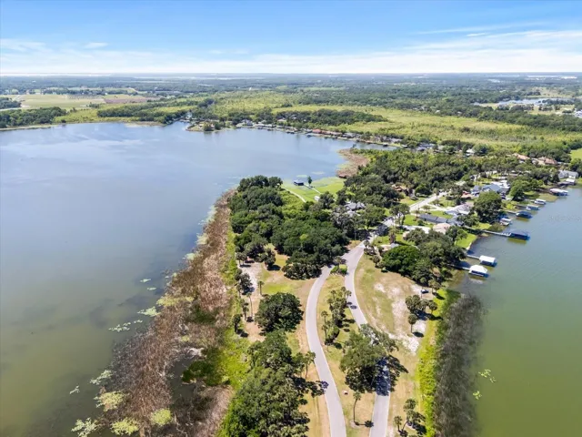 (Center left) property along Lake Beauclair with Lake Dora on the right of causeway