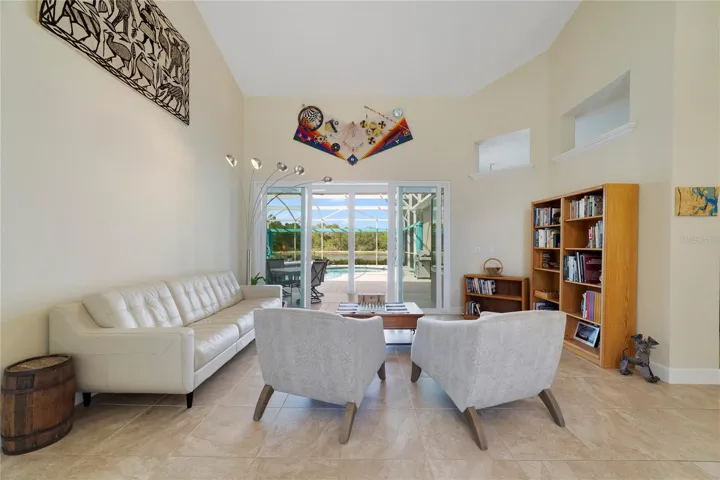 View of the pool and water/woods as you enter the front door