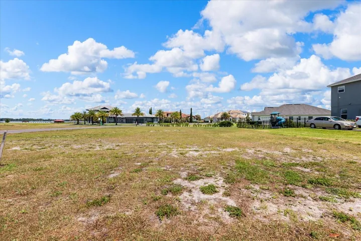 From front middle of lot on Sawgrass looking to back of property