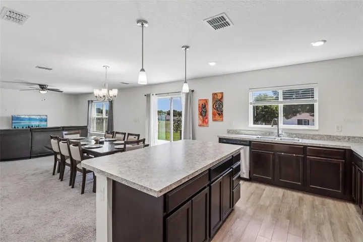 Kitchen is open to the dining and living areas.