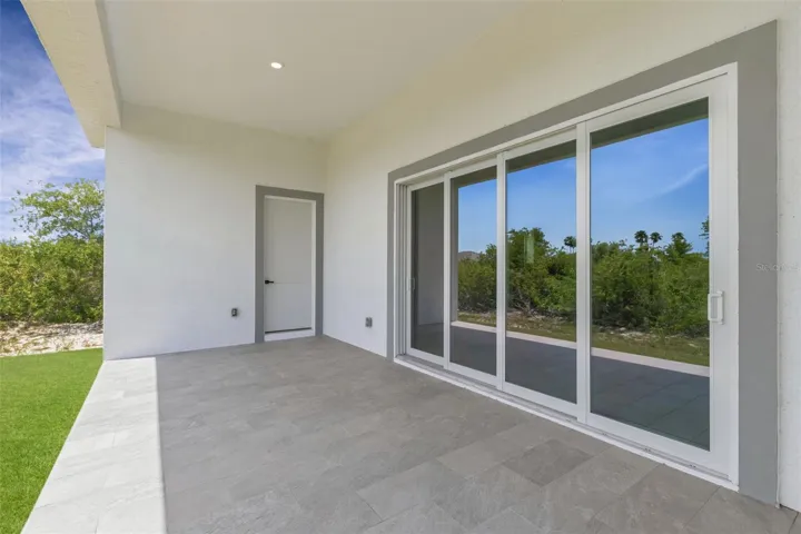 Covered Lanai 4-Panel Impact Sliding Glass Drs