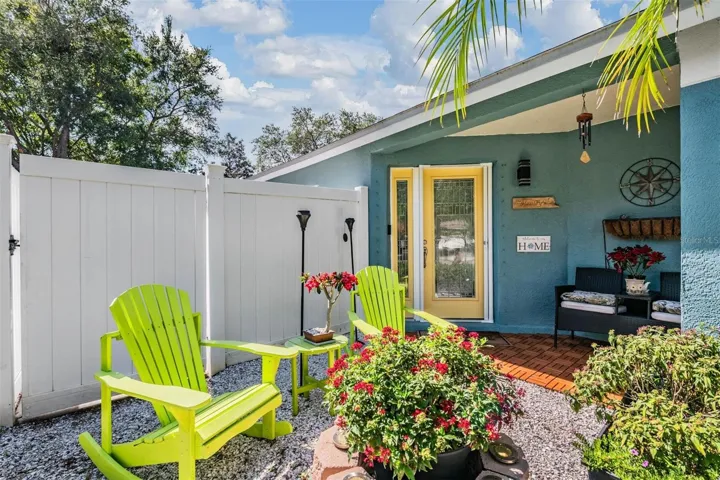 Welcoming front porch with sitting area - the Adirondack chairs stay!
