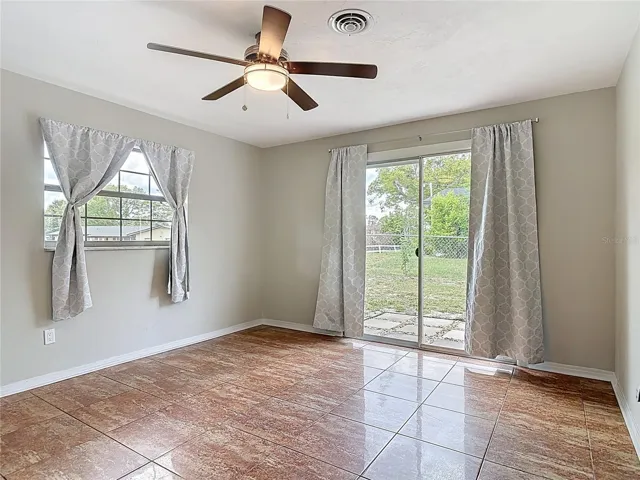 main bedroom has a 6 ft sliding door to the side patio