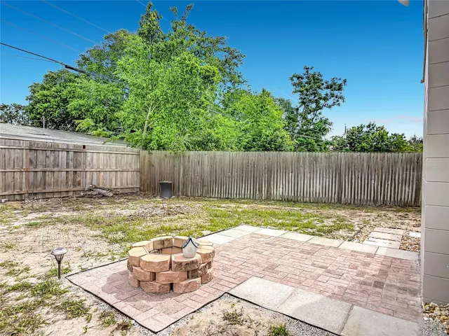 rear patio has a fire pit