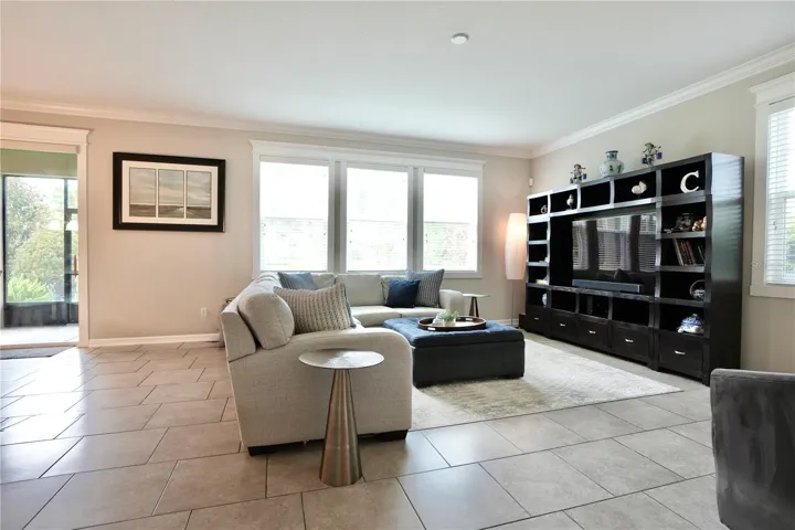 Spacious great room with an abundance of natural light, crown molding and custom window casings.