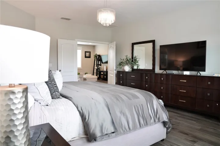 Double doors in the primary bedroom lead to the game room.