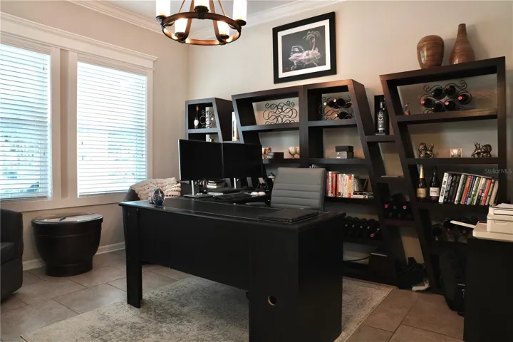 Office / flex space with tile floors, crown molding and custom window casings.