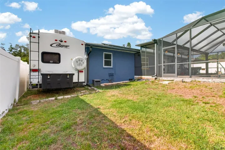 Room to park your RV or Boat within the fenced backyard next to the house.