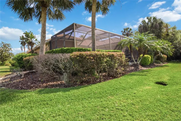 Lush backyard setting with mature landscaping and no visible neighboring homes.