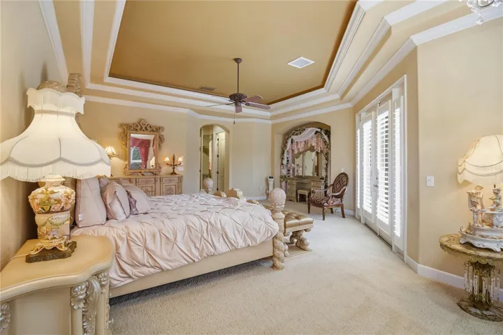Private primary retreat with built-in ceiling lighting and refined proportions.