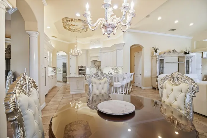 Casual dining area with elegant ceiling detail and refined entertaining space.