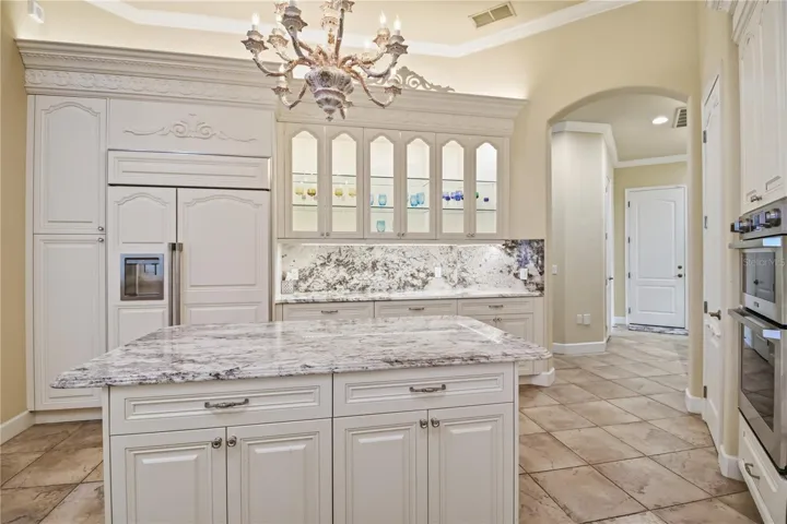 Beautifully finished kitchen with custom cabinetry and abundant workspace.