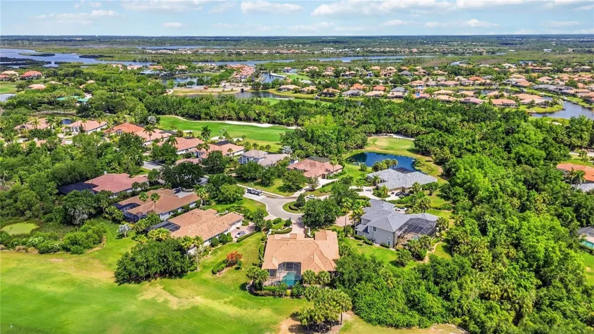 Aerial view highlighting the golf course setting and peaceful neighborhood surroundings.
