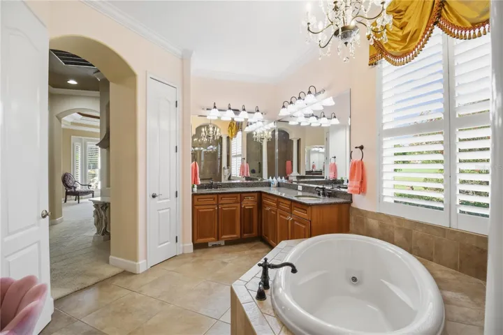 Spacious primary bedroom designed for comfort, privacy, and natural light.