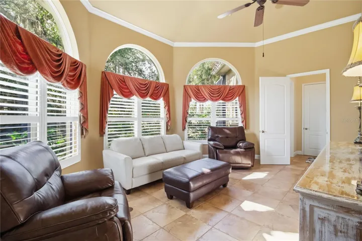 Comfortable sitting room with large windows and a relaxed retreat feel.
