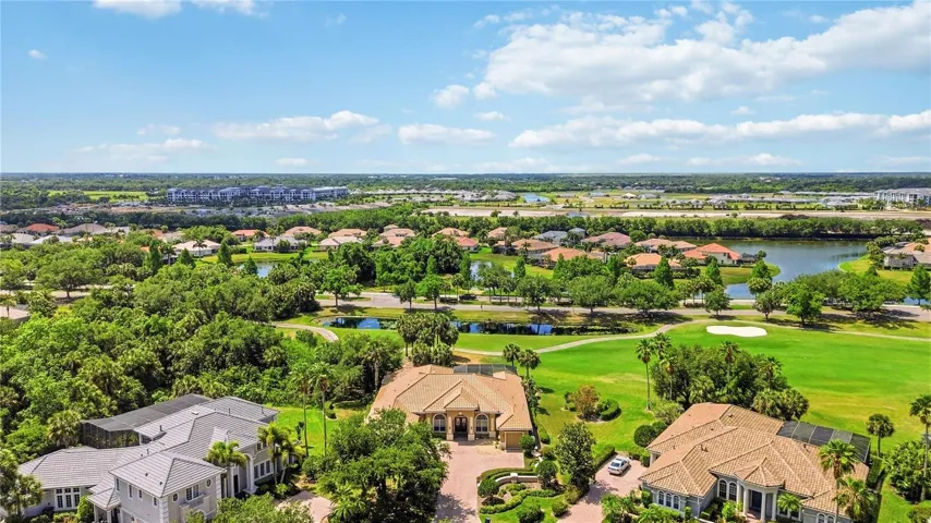 Elevated view showing the golf course backdrop and neighbors out of sight.