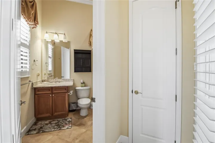 Pool bath with vanity storage and a bright, neutral finish.