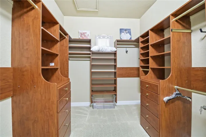 Second walk-in closet with custom built-ins for added wardrobe space.