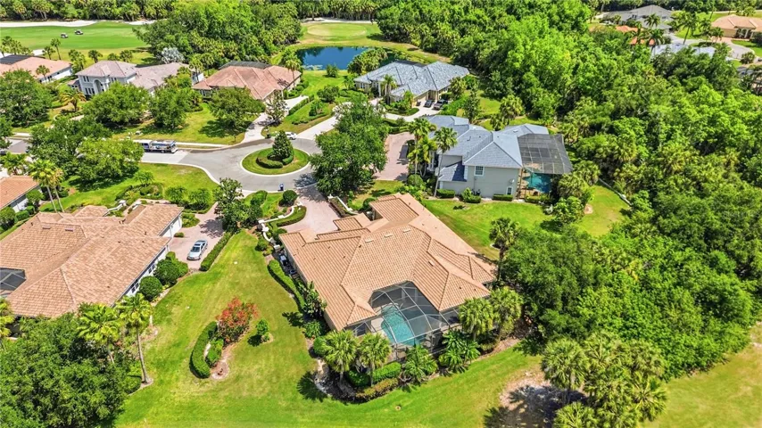 Aerial view showcasing mature landscaping and privacy on both sides of the home.
