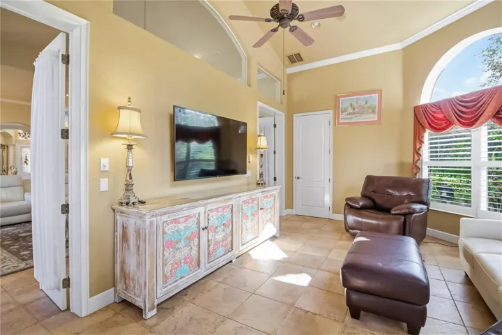 Flexible living area with built-ins, media space, and abundant natural light.