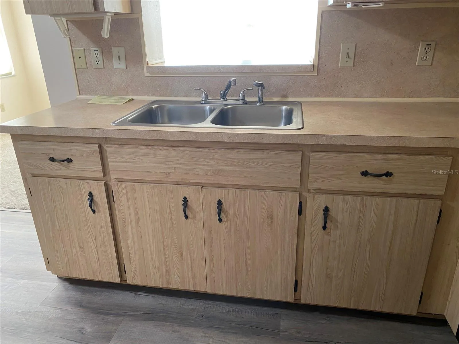 dual sink in the kitchen facing the lanai area