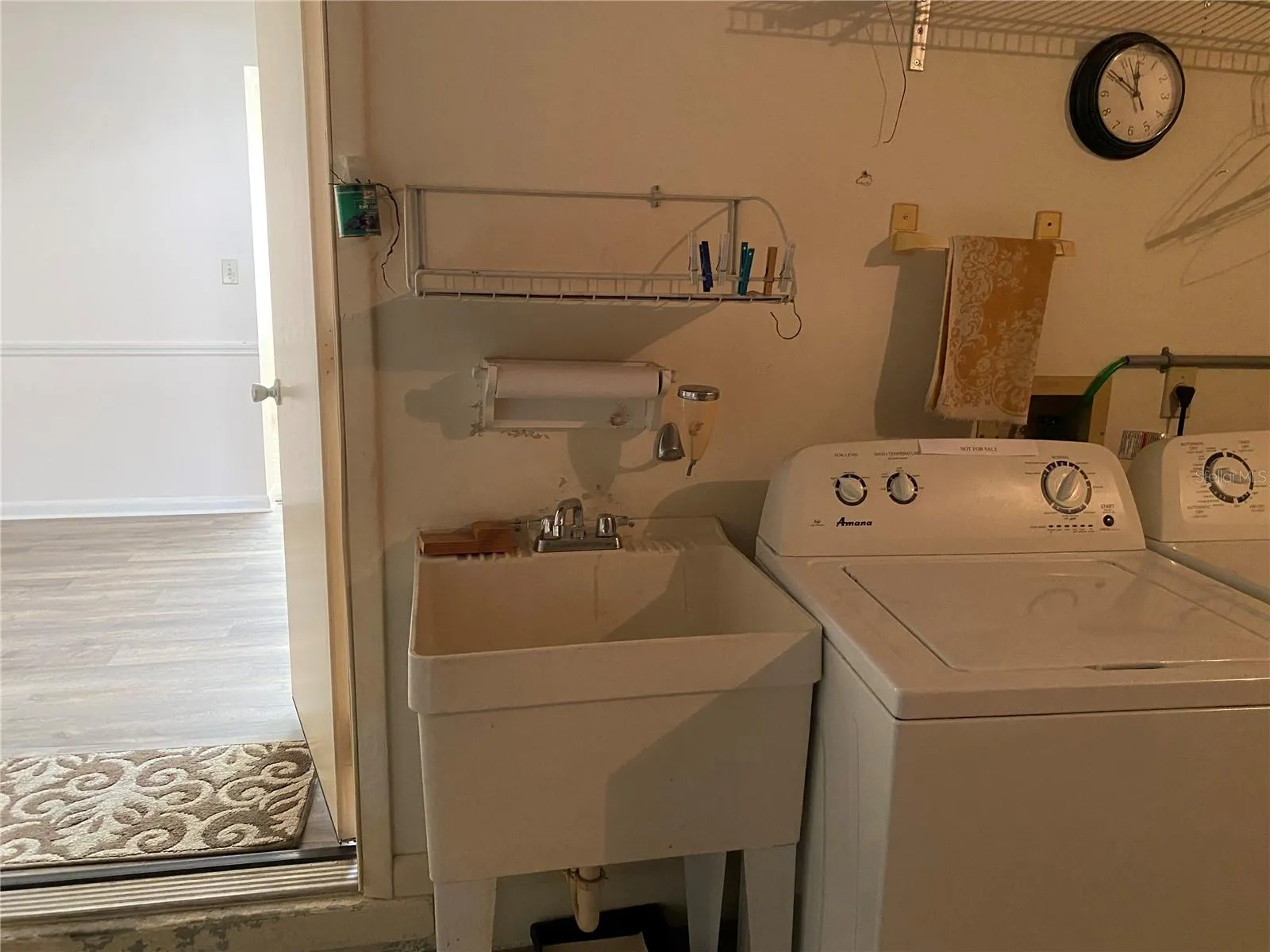 Tub next to the washer machine.