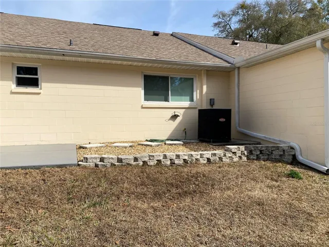 backyard with concrete slab for sitting outside