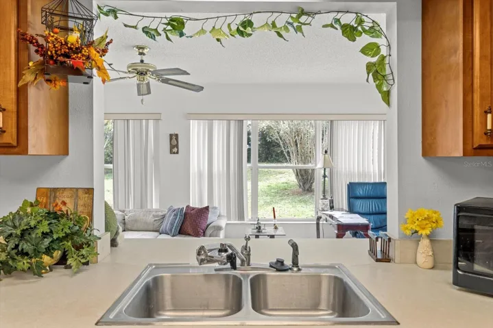 opening over kitchen sink to great room