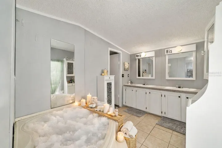 His & Hers sinks, lots of counter space.. Virtually staged Bubblrs & Accessories
