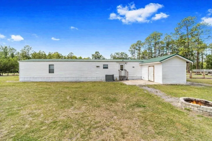 Large back patio, great for grilling.  Virtually staged