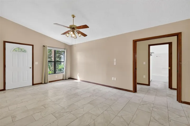 Bright and spacious living room filled with natural light, creating a warm and inviting gathering space.