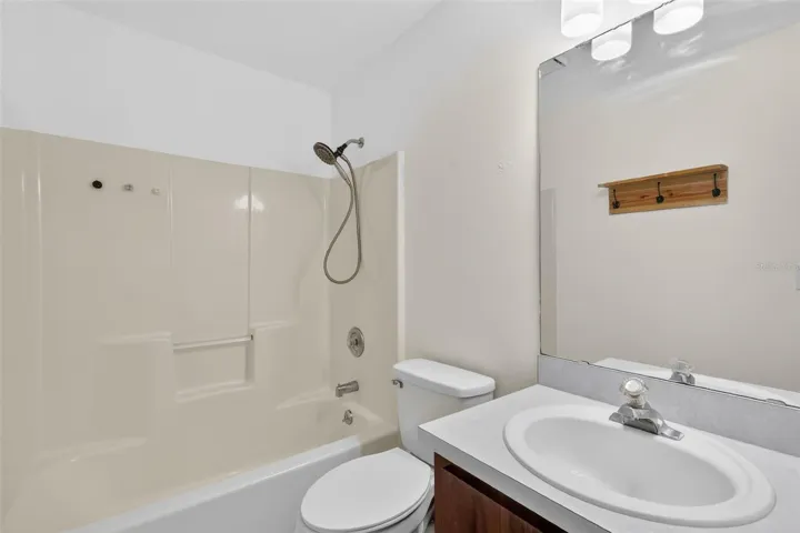 Newer toilet and vanity.