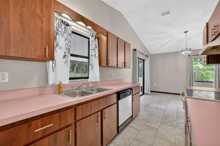 Plenty of cupboards in this efficient kitchen.