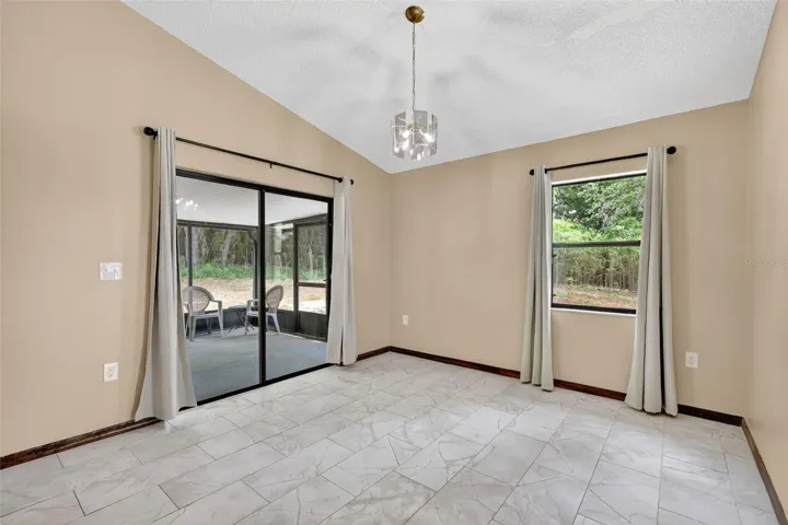 Dining area with direct access to the lanai, perfect for indoor-outdoor living and entertaining