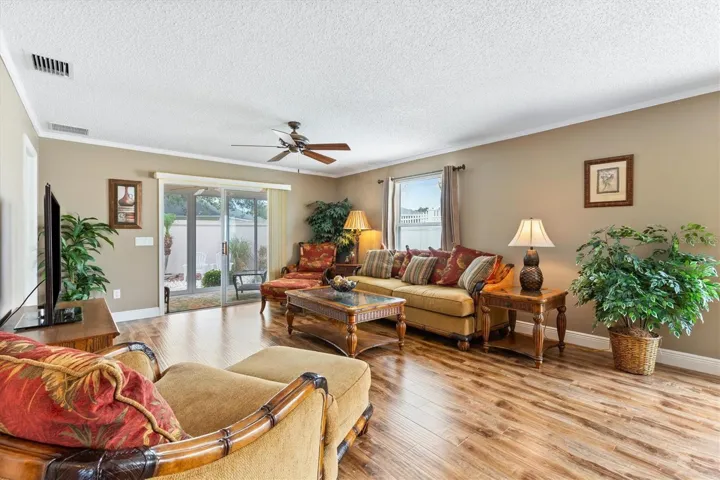 LIVING ROOM LOOKING TOWARDS BACK ENCLOSED LANAI
